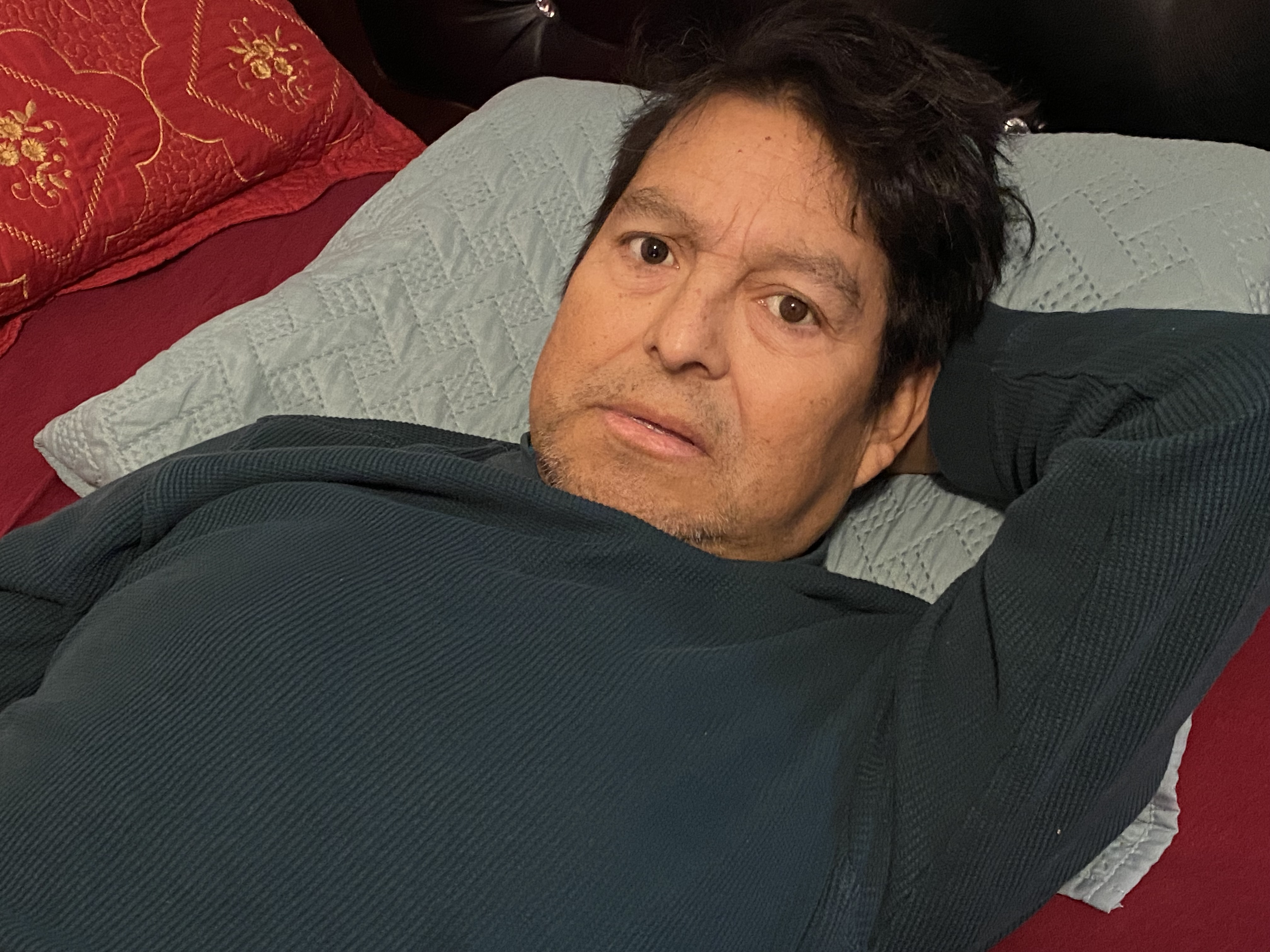 Jose Alejandro Lemuz laying on a pillow