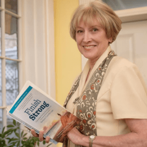 Barbara Coombs Lee holds her book 